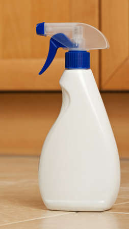 Plastic spray bottle on a kitchen floorの写真素材