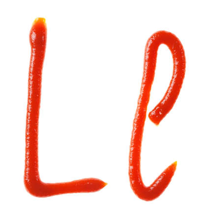Alphabet letters made from tomato, ketchup syrup are isolatedの写真素材