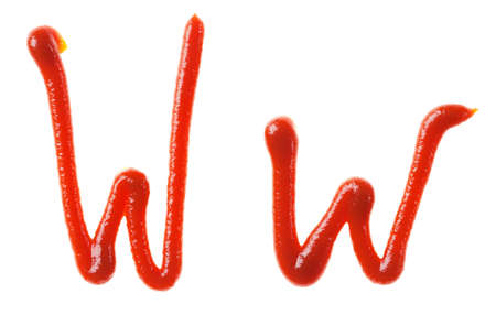 Alphabet letters made from tomato, ketchup syrup are isolatedの写真素材