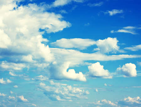 Blue sky, clouds and sun light. Summer time.