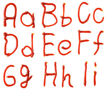 Alphabet letters made from tomato, ketchup syrup are isolatedの写真素材