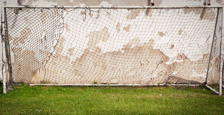 old football gates stand near the wall
