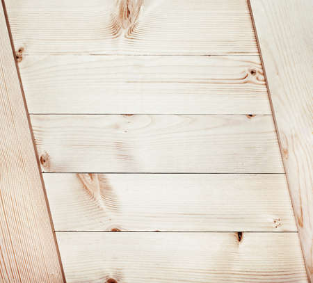 light wooden planks texture with branchの写真素材