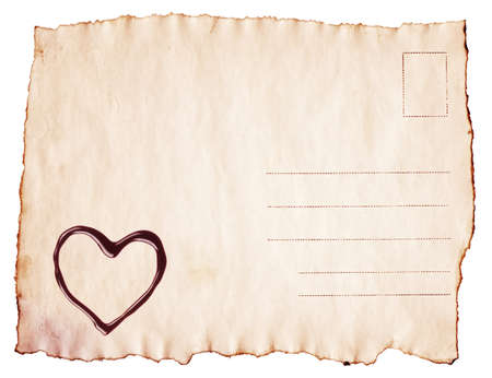 Vintage scorched postcard with chocolate heartの写真素材