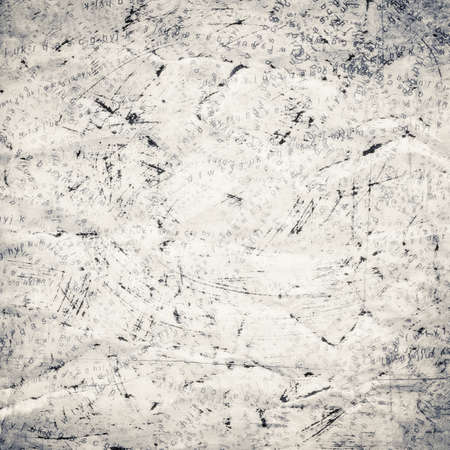 painted, torn collage background with lettersの写真素材