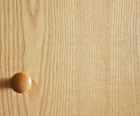 Door handle on wooden door の写真素材