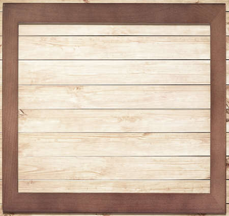 Vintage brown wooden frame on wooden planksの写真素材