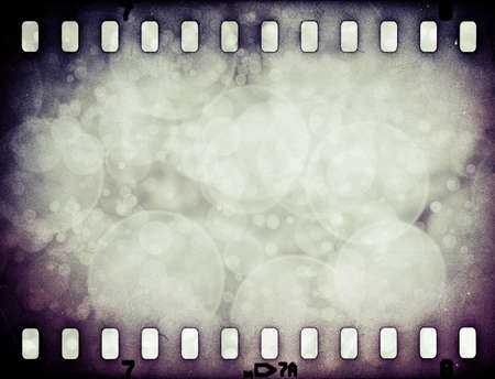Grunge scratched colorful film strip background with starsの写真素材
