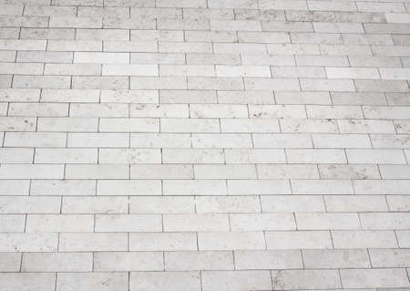 Brick stone street road. Light sidewalk, pavement textureの写真素材