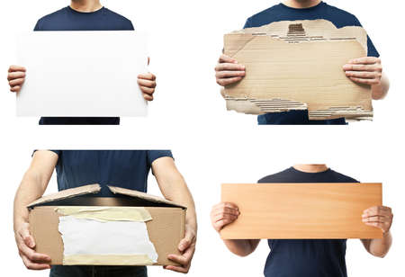 Men holding paper plank, box and white poster.の写真素材
