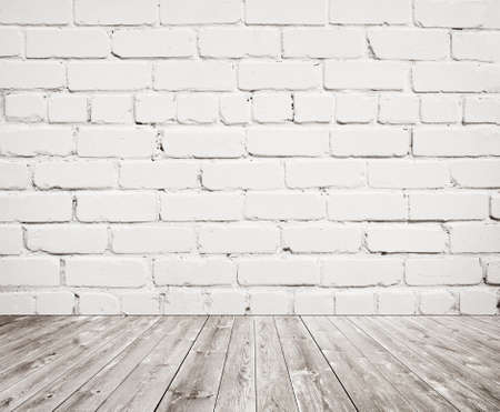 White brick wall texture with wooden floor.の写真素材