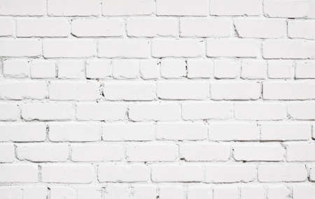White brick wall texture with wooden floor.の写真素材