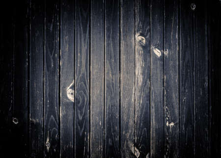 Dark gray scratched wooden wall, fence, table or floor surface.  Wood texture.の写真素材