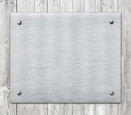 Composition of metal aluminum plaque, name plate on wooden wall planks.の写真素材