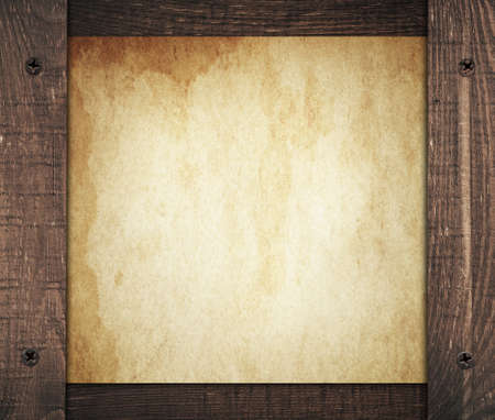 Composition of vintage dirty paper with old wooden wall planks.の写真素材