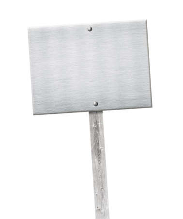 Aluminum metal plate nailed on wooden gray pole or banner.の写真素材