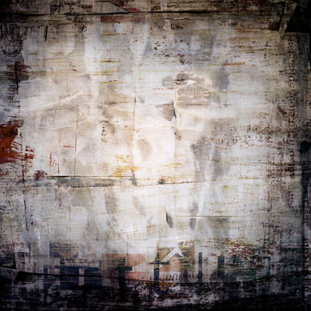 Grunge painted torn paper collage, cracked scratched background with letters.の写真素材