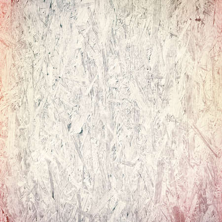 Light colorful recycled hardboard. Chipboard wall. Wooden texture