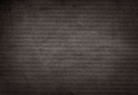 Dark grunge black striped recycled parchment paper texture.の写真素材