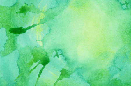 Abstract bright green watercolor splash background, painted on watercolor paperの写真素材