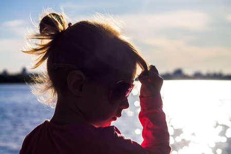The child runs on the coast in the sand.の写真素材
