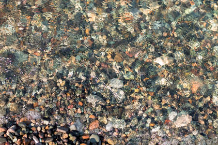 Texture of multi-colored stones on the black sea coastの写真素材
