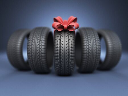 Tyre with a red ribbon. Gift. 3D Icon isolated on blue backgroundの写真素材
