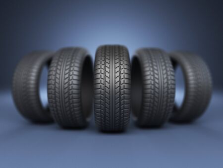 Row of rubber tire 3D, on blue backgroundの写真素材