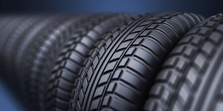 Row of rubber tire 3D, on blue backgroundの写真素材