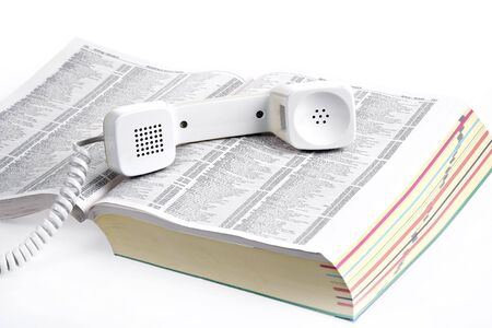 old style phone over yellow bookの写真素材