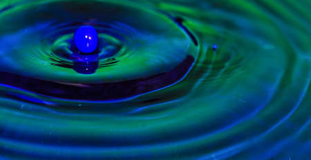 abstract background blue bright bubble  circle clean concept crown drop water macro stop freezeの写真素材