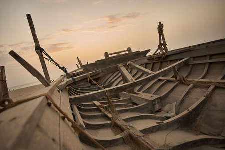 Boat on the beach at sunrise time Dubai