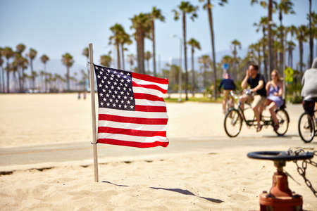 American Flag waving on Venice Beach Californiaの写真素材