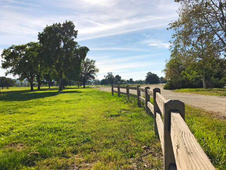 green golf field and blue cloudy sky. american landscape.の写真素材