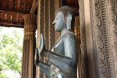 Buddha statue in Laos templeの写真素材