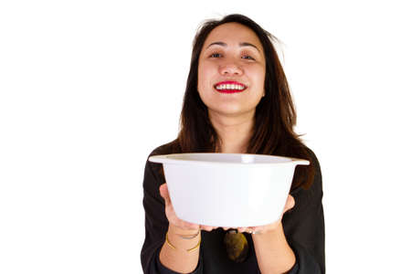 Malaysian lady in traditional dress with bowlの写真素材