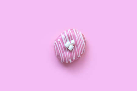 Classic pink donut with white marshmallows. Sweet food for party.
