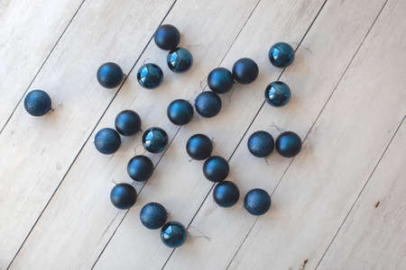 Ten blue christmas balls on a wooden background. New Year concept.の写真素材