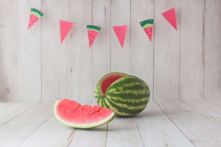 Photo zone with watermelon and paper flag garland on background. Summer time concept.の写真素材