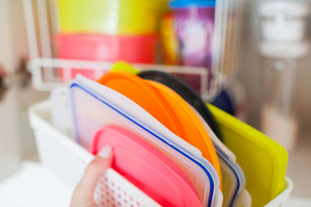 Storage in the kitchen. Towel organization in white basket.の写真素材