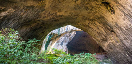 View inside the Devetashka Cave near Devetaki village and Osam river in Lovech, Bulgaria. Natural wonder. One of the largest karst cave in Eastern Europe, now home to near 30000 batsの写真素材
