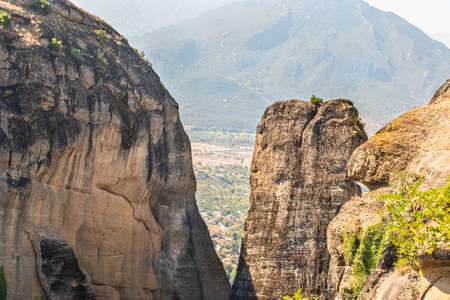 Monastery Meteora Greece. Stunning  panoramic landscape. View of mountains and green forest against epic blue sky with clouds. UNESCO heritage object.の写真素材