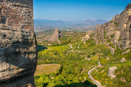 Monastery Meteora Greece. Stunning  panoramic landscape. View of mountains and green forest against epic blue sky with clouds.の写真素材