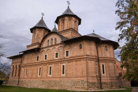 View of beautiful, old monastery in Targoviste, Romania, on a cloudy autumn day