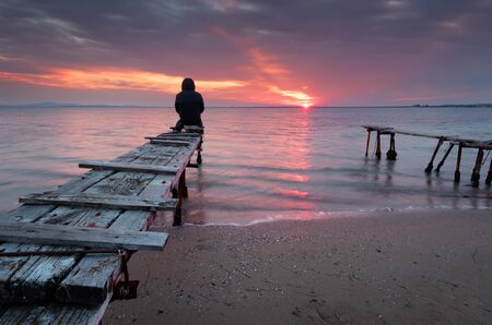 Magnificent sunset with clouds and fire sun in the middle of December, at the village of Ravda, Bulgariaの写真素材