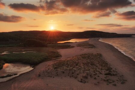 Cloudy summer sunset at Veleka river estuary, Sinemorets village, Bulgariaの写真素材