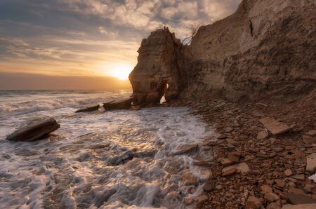Seascape during sunset. Beautiful natural seascape, blue hour. Sea sunset at the Black sea coast near Balchik, Varna, Bulgaria. Magnificent sunset with clouds and rocks.の写真素材