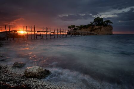 Beautiful sunrise, just before the storm rains. The famous Cameo island. A beautiful small island...