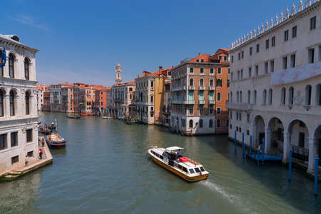 VENICE, ITALY, MAY 23, 2017: Magnificent daily view of Gondola with classical buildings along the famous Grand canal in Venice, Italyのeditorial素材