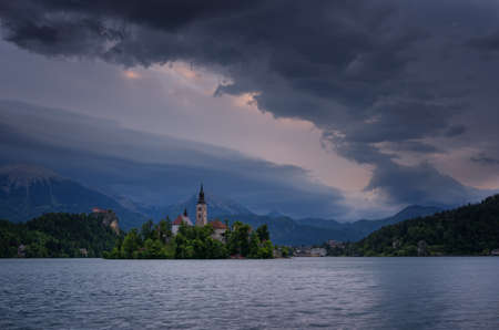 Amazing spring sunrise on Bled lake, Island, Church And Castle with Mountain Range (Stol, Vrtaca, Begunjscica) In The Background - Bled, Slovenia, Europeのeditorial素材